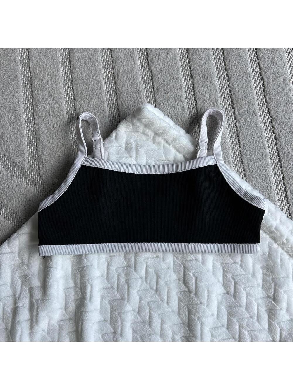 Black ribbed polyester & spandex bikini top with white trim, size S #activewear